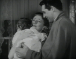 Irene Dunne, Cary Grant hold their newly adopted daughter in Penny Serenade