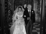 Elizabeth Taylor and Spencer Tracy walk down the aisle.